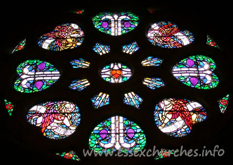 , Great%Warley Church - The rose window carries images of (from top left, clockwise) 
Ss Matthew, John, Luke and Mark.
The window is the work of Heywood Sumner.


