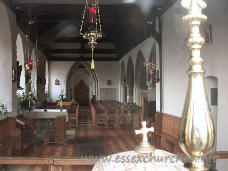 St Peter & St Paul, Hockley Church - This shot of the interior was taken through the east window, looking in above the altar. The four-bay arcade leading into a narrow N aisle can be seen to the right of the picture.

The triangularly-headed door at the W end sits within a ogee-shaped W doorway.