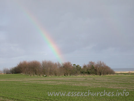 , Bradwell-juxta-Mare% Church - Just to the right was a beautiful rainbow, looking for all the 
world like it was designed to grow out of those trees.
