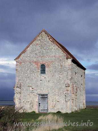 , Bradwell-juxta-Mare% Church - The W wall, showing the reused Roman bricks around the window.
