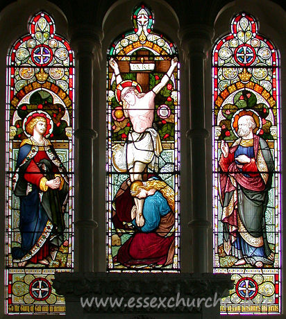 St Catherine, Wickford Church - The East window depicts Jesus on the cross, flanked by Saints. It is in memory of Henry Stone, churchwarden during the rebuilding of the church. It was recently (1998) restored.