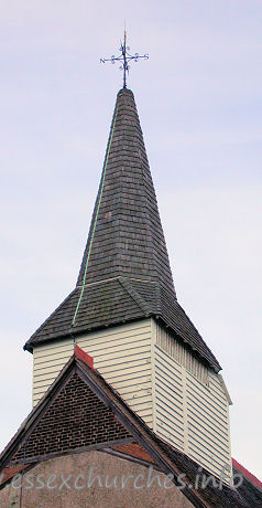 , Little%Burstead Church - 




The wooden belfry was constructed during the fifteenth century, and rests on six posts with beams on braces. It is crowned by a shingled broach spire.

