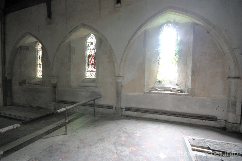 St John the Baptist, Mucking Church - Three arcades in the chancel wall, which would have once led into a C13 N chapel.