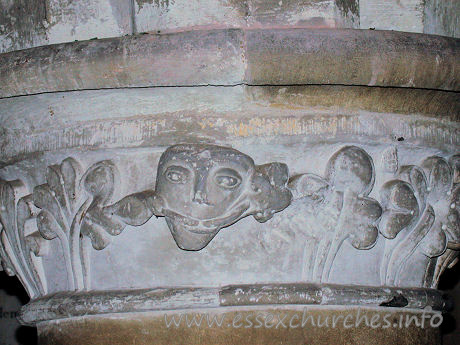 St Giles, Mountnessing Church - Pevsner mentions that the capitals are moulded, except for 
one, which he says is enriched by stiff leaf. He seems to have missed the 
unusual figure completely!



