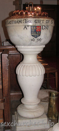 , East%Ham Church - This font consists of a bowl given by Sir Richard Heigham in 
1639, and a later pedestal.
