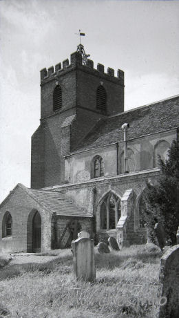 , Helion%Bumpstead Church - Taken from a picture in the church. Note the old porch, and the existence of the stone tracery in the windows. Compare this with Exterior Image 1.