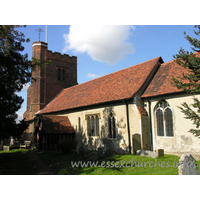 All Saints, Nazeing Church - A similar shot, though this time showing a little of the external chancel wall. The Norman nave window is clearly visible, just to the right of the porch.
 
The fine C16 tower is also evident here, with it's blue diapering, battlements and raised stair turret.
