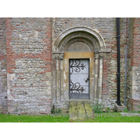St Michael & All Angels, Copford Church - The N doorway into the nave is Norman. It has two orders of columns with primitive capitals, and two roll mouldings in the arch.