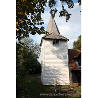 St Andrew, Greensted Church – Exterior 3: Here can be seen the tower, which according to a date on one of the bells "William Land made me 1618", is early-C17 or before. Many consider the tower to be earlier, as Essex is famed for it's mediaeval wooden towers and belfries.