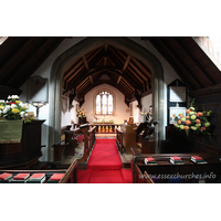 St Andrew, Greensted Church – Interior 2: Changes were again made to the interior of the church during Victorian times. In 1837 Philip Ray became rector, and saw to it that the neglected church was surveyed and restored. The work was undertaken by a local carpenter, James Barlow. The bases of the nave walls had to be cut off, and re-seated on a brick sill, due to rotting of the ancient timbers. Changes were made to strengthen the nave roof, and six dormer windows replaced the three tudor ones.