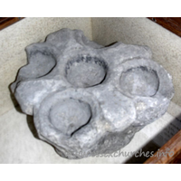 St Laurence, Blackmore Church – Miscellaneous 1: The Cresset Stone, which can be seen in the Church, dates from about this time. It is a primitive form of oil lamp made of stone containing several shaped hollows. These recesses were filled with oil in which was placed a floating wick. The example in the Church is one of the finest in the country and the only one in Essex and it was, without doubt, used in the Priory to light some dark passage. Source