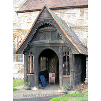 St Mary, South Benfleet Church – Exterior 5: This lovely S porch has panel tracery in the spandrels of the doorway, an embattled beam, tracery panels in the gable, cusped bargeboarding, and a two-bay hammerbeam roof inside. All in all, a rather lovely piece of craftsmanship.