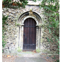 Holy Trinity, Southchurch Church – Exterior 5: This is the original Norman north door, relocated to become the west door of the new nave, after Comper's enlargements in 1906.