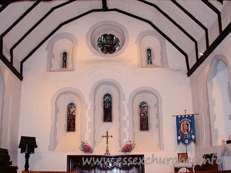 St Helen & St Giles, Rainham Church – Three stepped round headed lancet windows, with a large round window flanked by two narrow slits.