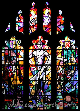 St Andrew, Hornchurch Church – Taken from the church's own website The new window on the North side of the Church was installed in 1991 to commemorate the Six Hundredth Anniversary of the connection with New College Oxford. On the left is William of Wykeham in 1391 receiving a document from Richard II allowing him to purchase the lands of the Monks of Montjeux in Havering to endow his new College of St. Mary in Oxford. In it the Church is described as the Parish Church of Havering commonly called the Horned Church. Beneath the figures are the Towers of New College and of the Parish Church. On the right is shown the Parish of 1991 with figures depicting worship outreach and pastoral care covering all ages and the cooperation of men and women and clergy and laity. This activity is shown in the local setting of recent history symbolised by a Spitfire representing the important role of Hornchurch R.A.F. Station in the Battle of Britain and local industry represented by a Ford Fiesta and an Amstrad Computer. Beneath the figures are the daughter churches of St George and St Matthew.