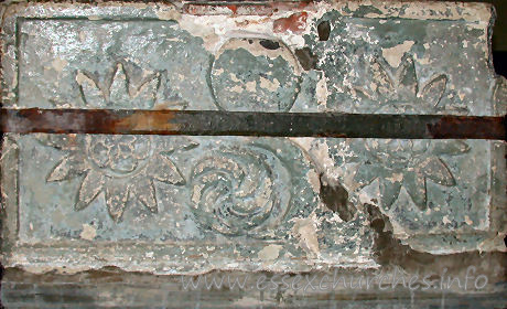 St Edmund, Abbess Roding Church – This side of the font shows two rosettes, a whorl, and the sun.