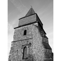 St Margaret, Bowers Gifford Church – Exterior 4: This tower is supported by just one buttress in the SW corner, but it is huge. Notice that the two windows in this wall of the tower are not aligned with one another. The upper, shuttered window appears to be central. Interestingly, in the rebuild plans of 1829-1830, shown at Church Plans Online, the windows are shown to be aligned.