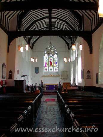 St Margaret, Stanford Rivers Church – This view of the church interior shows the nave roof with tie-beams on braces and king-posts.