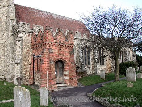 Holy Trinity, Rayleigh Church – This brick porch conceals a C13 South doorway. The porch itself has two-light brick side windows, and is crowned with stepped battlements upon a trefoil-arched corbel frieze.