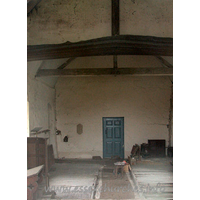 All Saints, Berners Roding Church – Interior 2: The glimpse through the E window shows a peculiar door at the end of the church. Quite what this door is doing, I am unsure, as the other side of it is a blank wall.