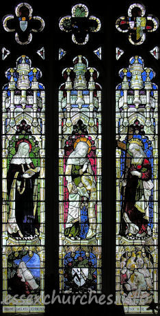 St Mary the Virgin, Great Bardfield Church – N aisle - W wall, representing "The Three Famous Mothers" - St Monica, St Anne and St Helena. The memorial inscription reads "Rose Helen Kirwan widow of the late Reverend Richard Kirwan and daughter of the late B E Lampet".