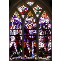 St Michael, Theydon Mount Church – Stained Glass 1: The East window, depicting St Michael's war in heaven against Lucifer, the rebel Archangel - afterwards called Satan, was given in memory of Major Charles Hunter and his wife. It has recently been restored, to prevent damage due to bending lead fittings.