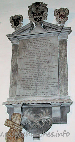 St Michael, Theydon Mount Church – Near this place lies interred Sr EDWARD SMYTH Baronet of Hill Hall in this Parish Son of Sr EDWARD SMYTH and JANE Daughter of PETER VANDEPUT Esqr Whom His Contemporaries well knew to be a man of Integrity, strict Justice and good Morals, to be a lover of Virtue and Religion and to have resolution enough to practice them: And Whose true character posterity may from this Inscription understand and learn to Imitate. He had two Wives. The first ANN, Daughter of the Right Honourable Sr CHARLES HEDGES Secretary of State, by whom he had five Sons, four of which and an only Daughter are now living: This Lady dying Octbr 18th 1719, He afterward Married ELIZABETH Daugther of JOHN WOOD of LONDON Esqr., who having survivied him, As a testimony of her great and constant Affection, has caused this Monument to be Erected to the Memory of her dear and worthy Husband, who died on the 16th of August 1744 in the 59th Year of his Age ELIZth, his Second LADY Died 23 of May 1748 Aged 57