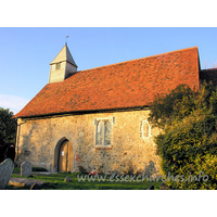 All Saints, Vange Church - The S wall of the church, showing the S door, and the blocked 
Norman window.
