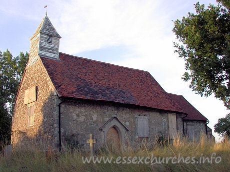 All Saints, Vange Church - The same side of the church, before repair work. Note the 
outline of a S porch in the brickwork. This has now been removed.
