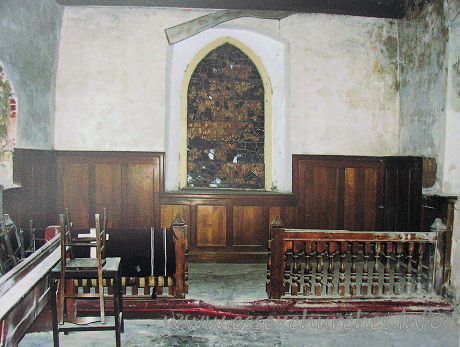 All Saints, Vange Church - The chancel, before work commenced. Note the shattered E 
window. Fragments of which have been used in the current E window. Again, taken 
from a picture on display inside the church.
