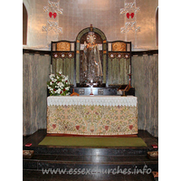 St Mary the Less, Great Warley Church - The chancel lower-wall is covered with a grey-green marble, 
and the ribbed vault is a metallic colour.
The centrepiece of the reredos is a striking figure of Christ. 
No question of what our attention should be grabbed by here then!

