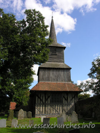 St Laurence, Blackmore Church - Seriously, though, this really is one of the finest, if not the finest timber church tower in the country. This claim is upheld by Pevsner and many others.
The tower consists of a lower storey with three lean-to roofs on each of the N, E and S sides. Directly above is an area of square weatherboarding. Above this, is another storey with four lean-to roofs, followed by what is a more common sight in this county - a square bell stage, topped with a shingled broach spire.
