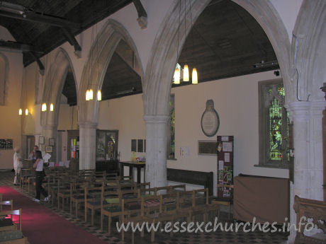 St Laurence, Blackmore Church - Looking towards the W end of the nave. Directly above Julie's head is a Norman window. This is one of a pair of upper windows that can still be seen.