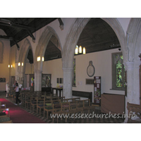 St Laurence, Blackmore Church - Looking towards the W end of the nave. Directly above Julie's head is a Norman window. This is one of a pair of upper windows that can still be seen.