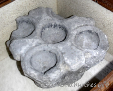 St Laurence, Blackmore Church - The Cresset Stone, which can be seen in the Church, dates from about this time. It is a primitive form of oil lamp made of stone containing several shaped hollows. These recesses were filled with oil in which was placed a floating wick. The example in the Church is one of the finest in the country and the only one in Essex and it was, without doubt, used in the Priory to light some dark passage. Source