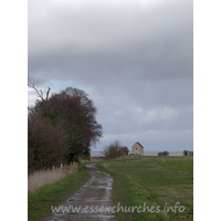 St Peter-on-the-Wall, Bradwell-juxta-Mare  Church - I'd driven out to Bradwell, intending to do quite a few 
churches that day. As I passed Woodham Ferrers, the weather started to turn 
rather dark, and it looked as though I was in for rather a wet day. As I pulled 
up to the car park just before the farm track leading to St Peter's, the weather 
began to brighten up somewhat. This first picture still clearly shows the haze 
that was present near the coast that day, not to mention the mess that had been 
created on the track.
