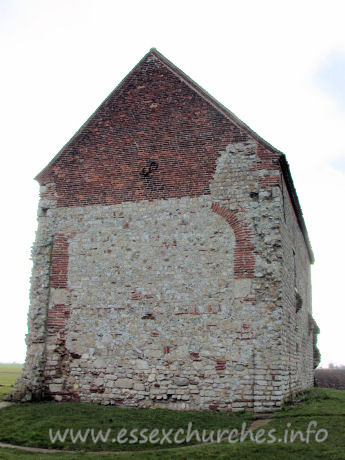 , Bradwell-juxta-Mare% Church - The W wall, clearly showing the arched brickwork where this 
once joined onto an apsidal chancel. The chancel is marked on the ground. It was 
demolished once the chapel was put to alternative uses as a barn, sometime in 
the seventeenth century. Only in the early twentieth century was the building 
returned to its original use.
