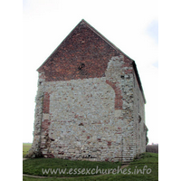 St Peter-on-the-Wall, Bradwell-juxta-Mare  Church - The W wall, clearly showing the arched brickwork where this 
once joined onto an apsidal chancel. The chancel is marked on the ground. It was 
demolished once the chapel was put to alternative uses as a barn, sometime in 
the seventeenth century. Only in the early twentieth century was the building 
returned to its original use.
