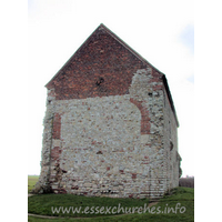 St Peter-on-the-Wall, Bradwell-juxta-Mare  Church - The W wall, clearly showing the arched brickwork where this 
once joined onto an apsidal chancel. The chancel is marked on the ground. It was 
demolished once the chapel was put to alternative uses as a barn, sometime in 
the seventeenth century. Only in the early twentieth century was the building 
returned to its original use.
