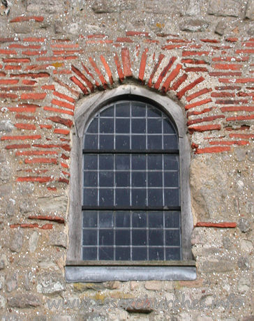 , Bradwell-juxta-Mare% Church - A closer view of the Roman bricks around the W window.
