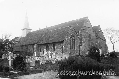 Holy Trinity, Southchurch Church - This postcard shows, quite clearly, the east end of the 
church, following the first phase of enlargement. Notice that the east end of 
the entire enlarged church is at the same level as the east end of the Norman 
church. And notice that the finish of the central east wall is the same as the 
finish as that of the north aisle.
The next image shows an enlarge image of the east end.

