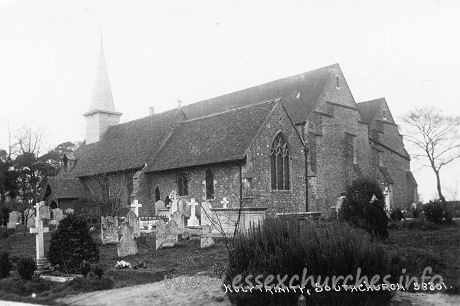 Holy Trinity, Southchurch Church - This postcard shows, quite clearly, the east end of the 
church, following the first phase of enlargement. Notice that the east end of 
the entire enlarged church is at the same level as the east end of the Norman 
church. And notice that the finish of the central east wall is the same as the 
finish as that of the north aisle.
The next image shows an enlarge image of the east end.

