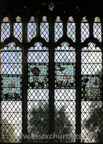 St John the Baptist, Thaxted Church - This stained glass window (and the following four enlargements of the panels within it) depicts Adam and Eve. The original glass in the panels dates from C15.