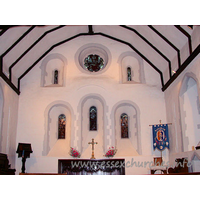 St Helen & St Giles, Rainham Church - Three stepped round headed lancet windows, with a large round 
window flanked by two narrow slits.

