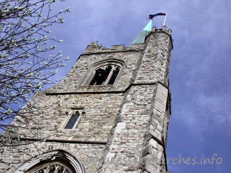 St Andrew, Hornchurch Church - This view directly up the W front of the tower shows the sheer height of the spire and tower combined. Note the small bell across the top window.
