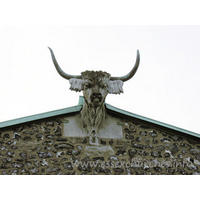 St Andrew, Hornchurch Church - Taken from the church's own website
The horned bull's head on the east end of the chancel is an unusual feature to find on a church, as horns are more generally associated with the devil. It would seem that the church had the horned bull before the town was called Hornchurch, as the first written reference, in 1222, refers to 'monasterium cornutum' or 'horned church/monastery' at Havering. The first reference to the horns on the east end of the church is in 1610 when they were said to be made of lead. When they were repaired in 1824 they were found to be of copper. It is reasonable to suppose they had been replaced during the intervening 200 years, but neither mentions the stone head, merely the horns. There are numerous legends and theories to explain their existence and whilst the truth may remain obscure the head forms a unique feature of the church.
In 1999 the copper horns were stolen from the bulls head. The horns are priceless and were never recovered. The Horns were replaced in 2001 allowing Hornchurch to live up to its name.