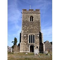 St Mary, Chadwell St Mary Church - Diagonally buttressed tower, with W doorway. Small ogee-headed niche to it's right.