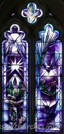 St Mary, Broxted Church - One of two two-light 'hostage' windows by John Clark. This 
window symbolises Freedom. It was put in in 1993 to commemorate the long cruel 
captivity and eventual release of journalist John McCarthy, an active churchman, 
whose home before his kidnapping was the big house next door.

