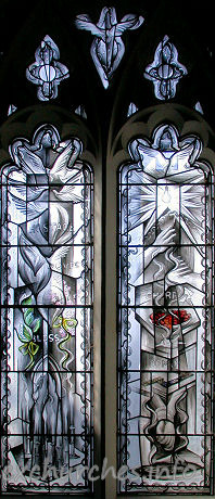 St Mary, Broxted Church - One of two two-light 'hostage' windows by John Clark. This 
window symbolises Captivity. It was put in in 1993 to commemorate the long cruel 
captivity and eventual release of journalist John McCarthy, an active churchman, 
whose home before his kidnapping was the big house next door.

