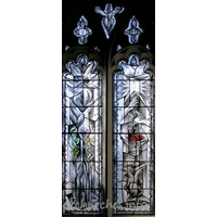 St Mary, Broxted Church - One of two two-light 'hostage' windows by John Clark. This 
window symbolises Captivity. It was put in in 1993 to commemorate the long cruel 
captivity and eventual release of journalist John McCarthy, an active churchman, 
whose home before his kidnapping was the big house next door.

